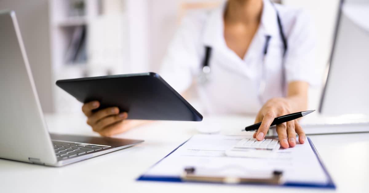 Doctor reviewing medical after a car crash | The Haynes Firm Tennessee personal injury lawyers