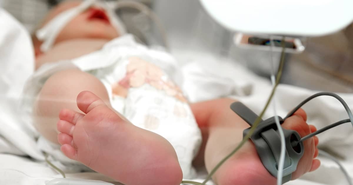 infant in incubator